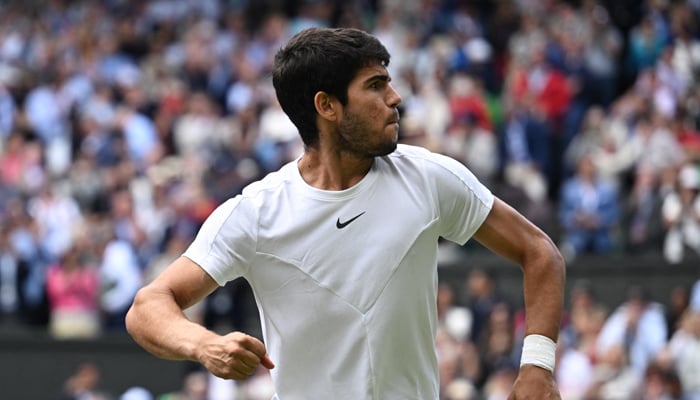 Spains Carlos Alcaraz celebrates after winning his quarter final match against Denmarks Holger Rune July 12, 2023. — Reuters