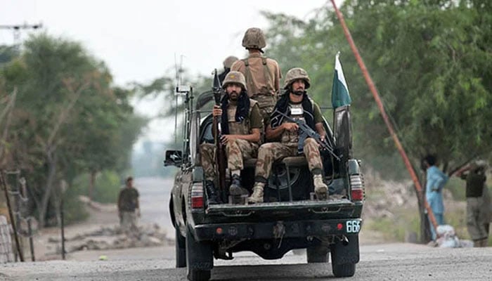 In this file photo, Pakistani army soldiers patrol in a vehicle. - AFP
