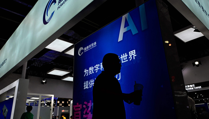 People visit the World Artificial Intelligence Conference (WAIC) in Shanghai on July 6, 2023. — AFP