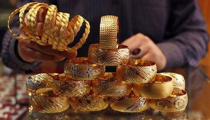 A jeweller displays gold bangles at his shop in Istanbul, Turkey. — Reuters/File