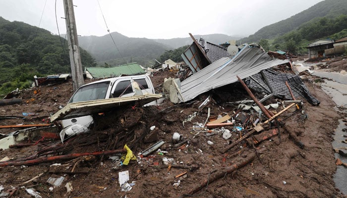 A damaged house is seen after a landslide in a small village in Yecheon on July 15, 2023. - AFP
