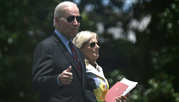 US President Joe Biden and US First Lady Jill Biden walk to board Marine One on the South Lawn of the White House on July 14, 2023 in Washington, DC. - AFP