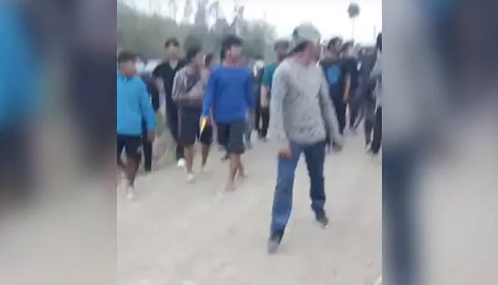 A video grab shows men in the mob that paraded two women naked amid Manipur violence. — social media