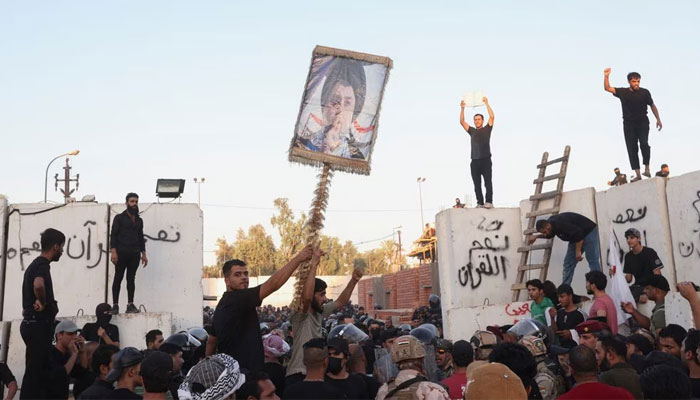 Protesters clash with security forces members as they gather near the Swedish embassy in Baghdad hours after the embassy was stormed and set on fire ahead of an expected Holy Quran burning in Stockholm, in Baghdad, Iraq, July 20, 2023. — Reuters