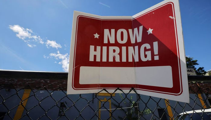 A now hiring sign is displayed outside Taylor Party and Equipment Rentals in Somerville, Massachusetts, US, September 1, 2022. — Reuters