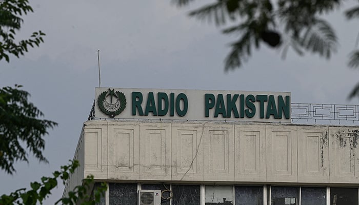 The logo of Radio Pakistan is pictured on the building facade at its headquarters in Islamabad on June 24, 2023. — AFP