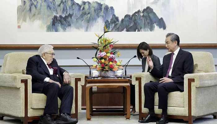 This handout picture taken and released by Chinas Ministry of Foreign Affairs on July 19, 2023, shows Director of the Office of the Foreign Affairs Commission of the Communist Party of Chinas Central Committee Wang Yi (R) speaking with former US Secretary of state Henry Kissinger (L) during a meeting in Beijing. — AFP