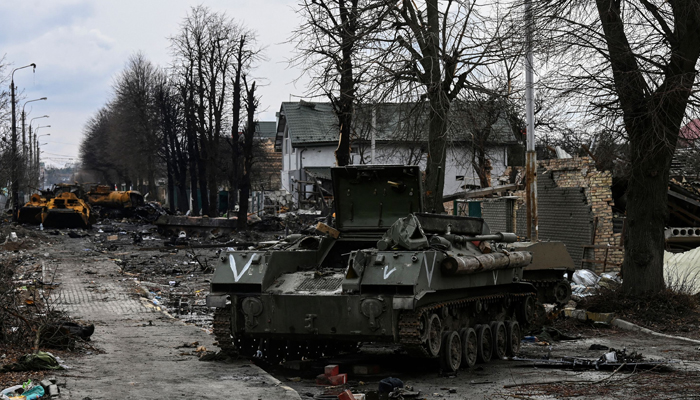This photo taken on March 4, 2022, shows a destroyed Russian armored vehicle in the city of Bucha, west of Kyiv. — AFP