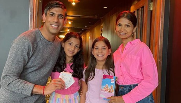 UK PM Rishi Sunak and family is all smiles in this picture taken at a theatre. — Twitter/@RishiSunak