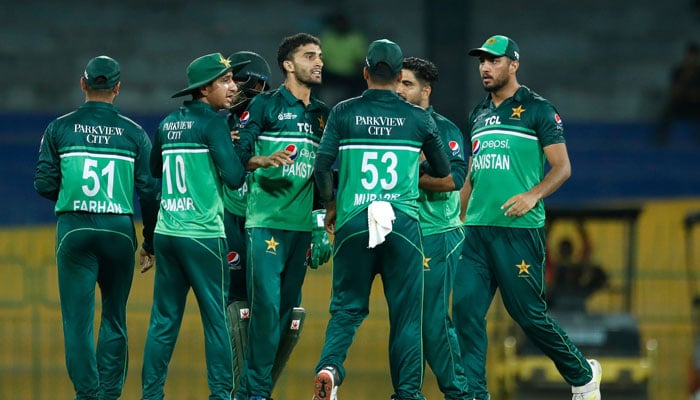 Pakistani players celebrate after dismissing an Indian batsman. - PCB
