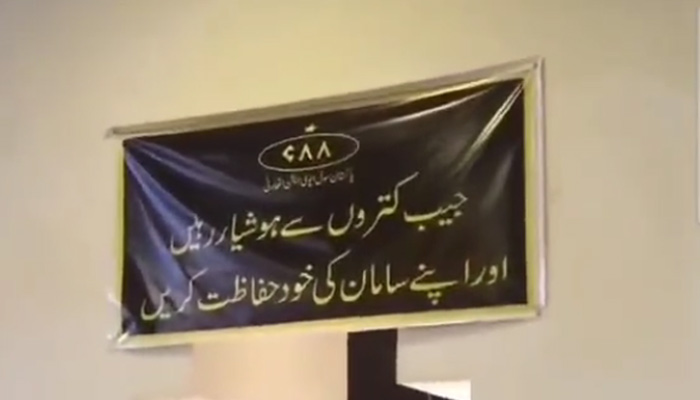 A screengrab showing CAAs caution banner put up at a spot at Jinnah International Airport. — Twitter/ArifRohila