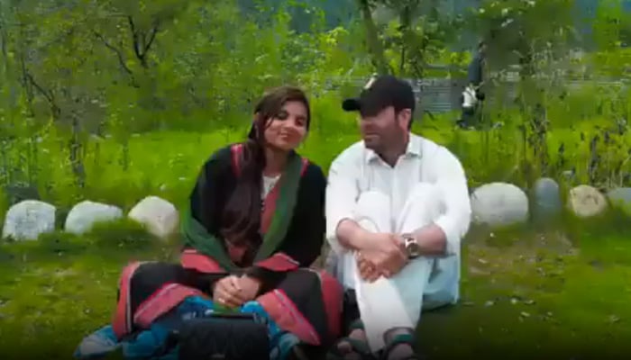 Indias Anju and her Pakistani husband Nasrullah are seen in this screengrab taken from a Faceebook video.