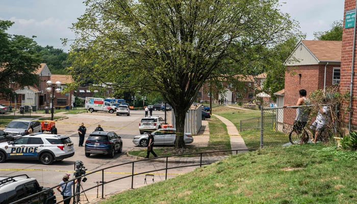 Baltimore Police investigates the site of a mass shooting in the Brooklyn Homes neighbourhood on July 2, 2023, in Baltimore, Maryland. — AFP