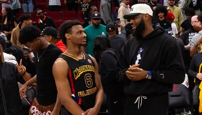 West guard Bronny James (6) with father LeBron James following the McDonalds All American Boys high school basketball game at Toyota Center. — Reuters/File