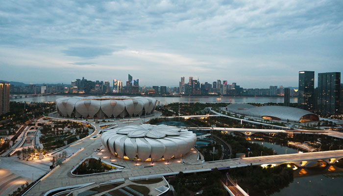 This picture shows the Hangzhou Olympic Sports Centre, including the Gymnasium and Aquatics Centre (right), Tennis Centre (front) and main stadium (back), which will host the competition at the Asian Games in Hangzhou, in Chinas eastern Zhejiang province, on June 29, 2023. — AFP