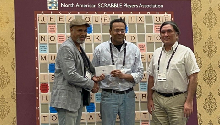 Pakistans Muhammad Inayatullah is awarded the winning prize for the Late Bird tournament at the World Scrabble Championship. — Photo by author