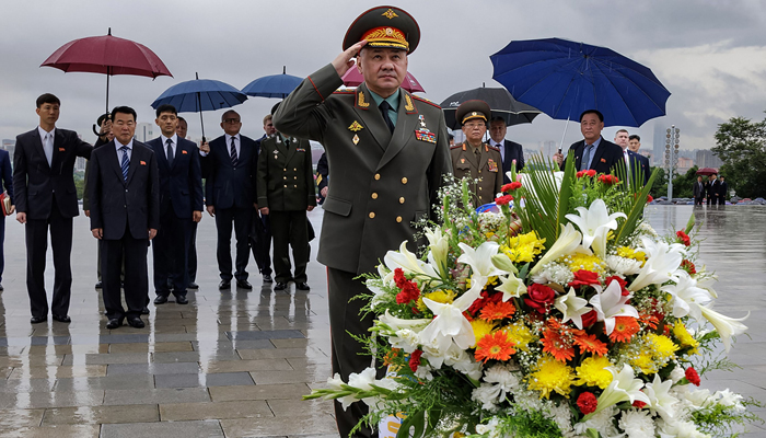 This picture taken on July 26, 2023, shows Russian Defence Minister Sergei visiting the statues of the late North Korean leaders Kim Il Sung and Kim Jong Il at Mansu Hill in Pyongyang. — AFP
