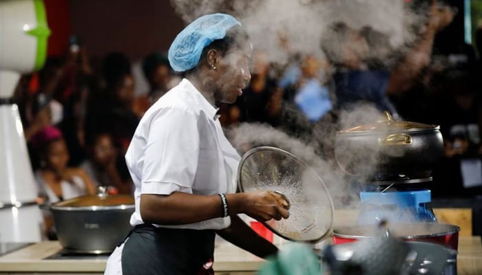 Nigerian Chef Hilda Bassey, 27, attempts to break the Guinness World Record for the longest cooking time by an individual, in Lagos, Nigeria May 15, 2023. — Reuters