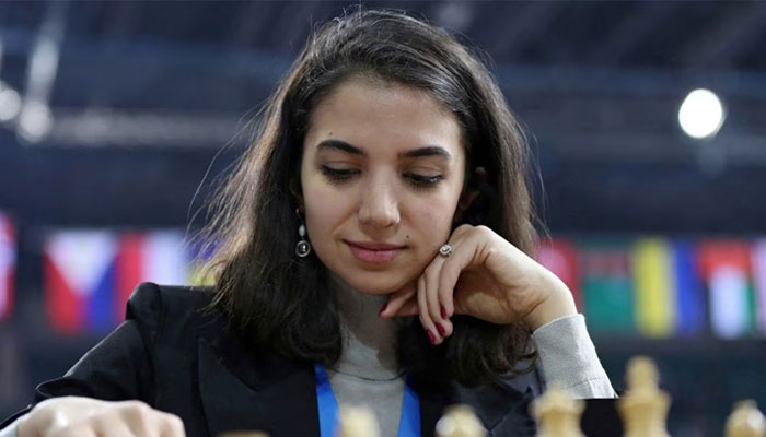 Sara Khadem of Iran plays against Olga Girya of Russia in Almaty, Kazakhstan on 28 December 2022. — Reuters