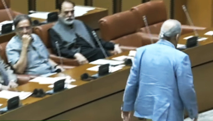 PPPs Raza Rabbani walks out in protest during a Senate session, on July 27, 2023, in this still taken from a video. — YouTube/PTVParliament