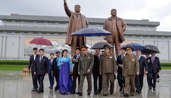 This picture taken on July 26, 2023, shows Russian Defence Minister Sergei Shoigu visiting the statues of the late North Korean leaders Kim Il Sung and Kim Jong Il at Mansu Hill in Pyongyang. — AFP