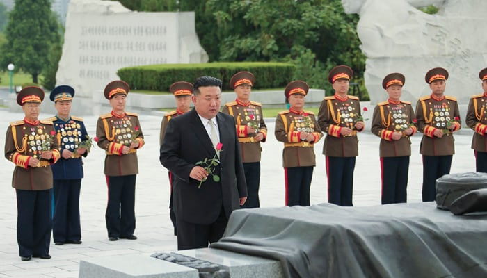 This picture taken on July 25, 2023, shows North Korean leader Kim Jong Un (C) visiting the Fatherland Liberation War Martyrs Cemetery on the occasion of the 70th anniversary of the victory in the great Fatherland Liberation War. — AFP