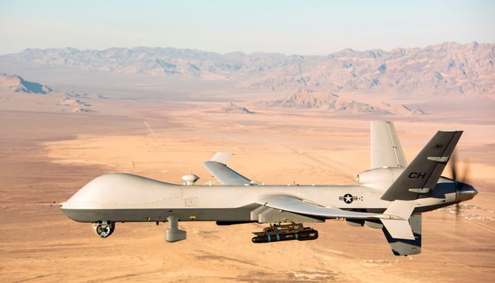This photo taken on November 07, 2020, shows an MQ-9 Reaper unmanned aerial vehicle (UAV or drone) flying over the Nevada Test and Training Range on January 14, 2020. — AFP