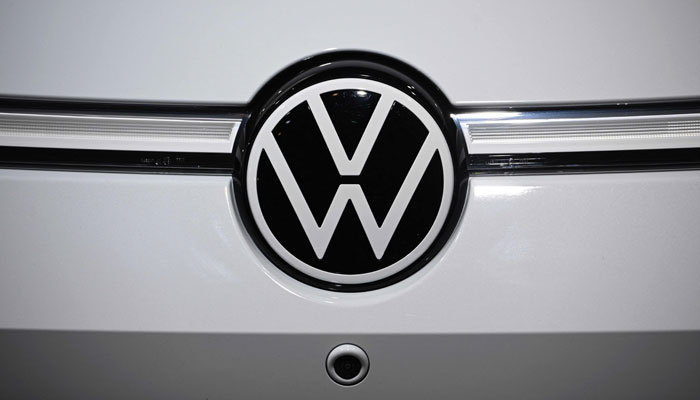 The logo of German car maker Volkswagen (VW) can be seen on the front of a VW ID.7 car on display at the annual general meeting of German carmaker Volkswagen in Berlin on May 10, 2023. — AFP
