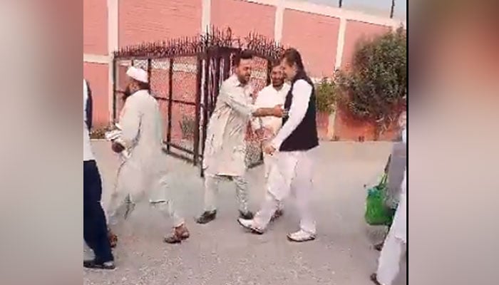Pakistan Tehreek-e-Insaf (PTI) senior leader Ali Muhammad Khan walking out of prison in this still taken from a video on July 27, 2023. — Twitter/@PTI