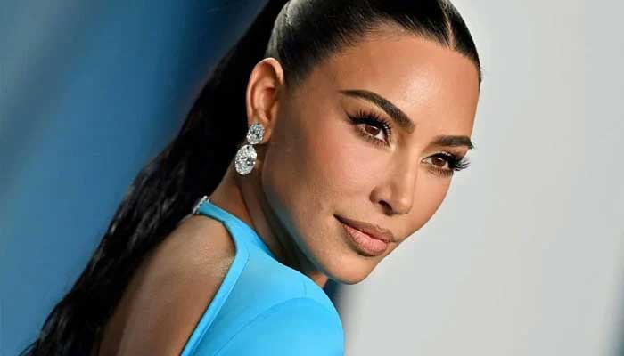 Kim Kardashian poses for picture with David Beckham