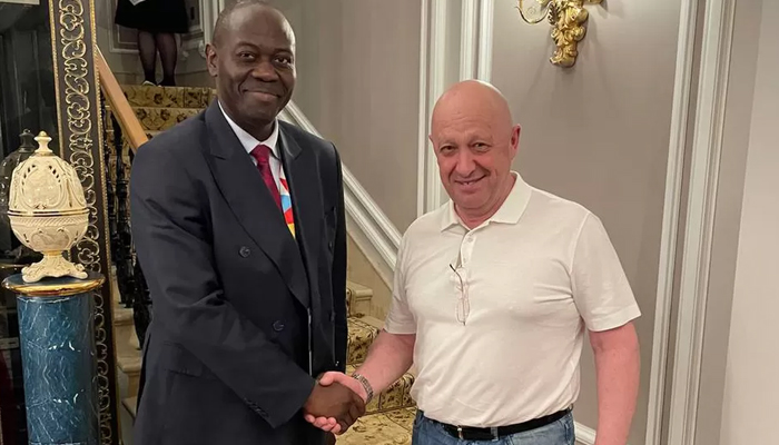 Ambassador Freddy Mapouka while meeting with Wagner chief Yevgeny Prigozhin at the Trezzini Palace Hotel in St Petersburg. — Facebook/Dimitry Syty