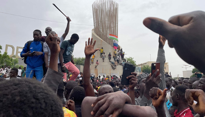 Supporters of the Nigerien defence and security forces gather during a demonstration outside the national assembly in Niamey on July 27, 2023. — AFP