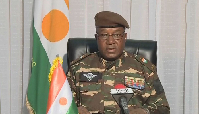 This video grab image obtained on July 28, 2023 shows General Abdourahamane Tchiani, Nigers new leader, reading a statement as President of the National Council for the Safeguarding of the Fatherland, after the ousting President Mohamed Bazoum. — AFP