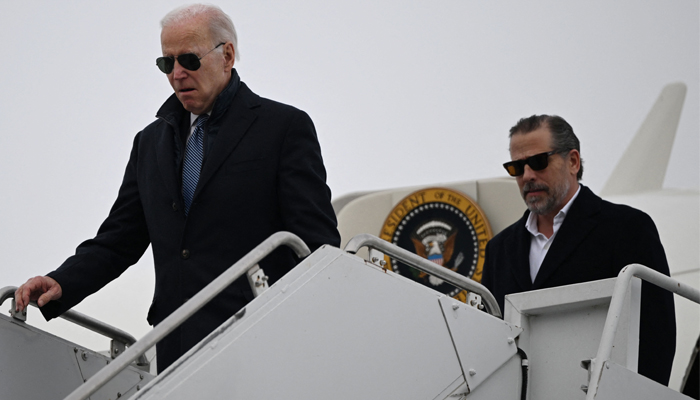 US President Joe Biden, with son Hunter Biden, arrives at Hancock Field Air National Guard Base in Syracuse, New York, on February 4, 2023. — AFP