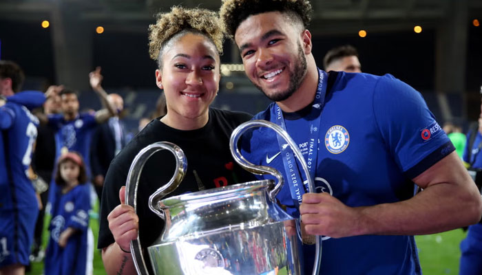 Reece James, right, with sister Lauren, left, after the Chelsea men’s team’s Champions League triumph over Manchester City in Porto in May 2021 independent.com