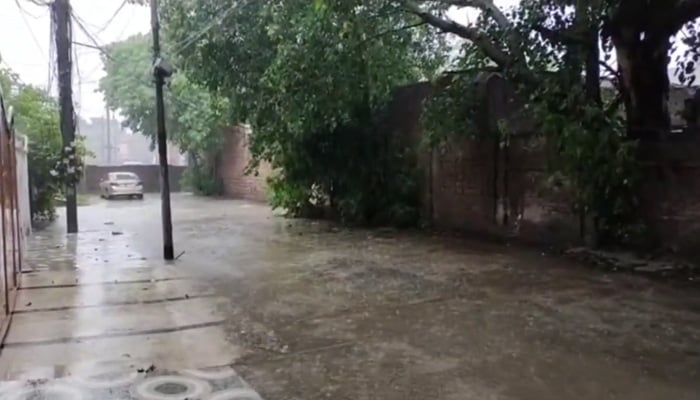 The view of a street filled with water during rain in Lahore on July 29, 2023 in this still from a video. — Twitter/WeatherWupk