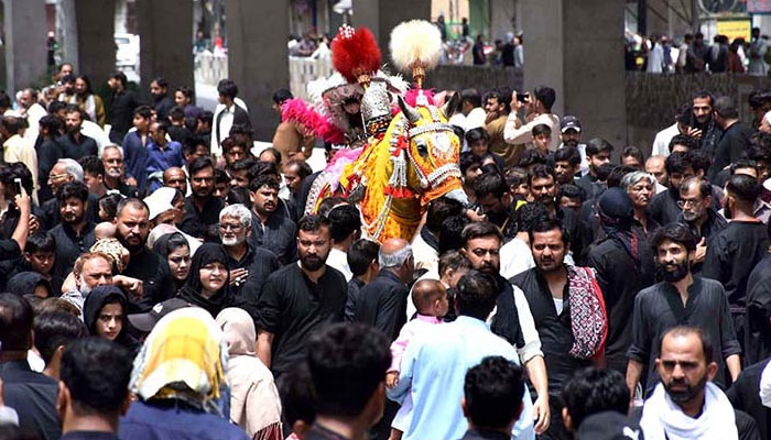 A large number of Shiite Muslims participate in 10th Muharram procession to mark Ashoura in Rawalpindi on July 29, 2023. — APP