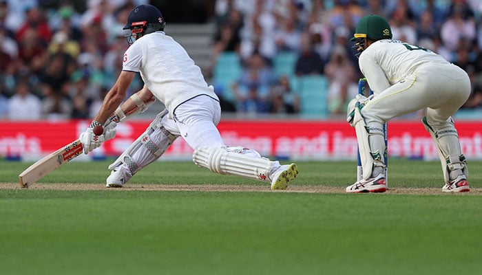 England´s James Anderson attempts a reverse sweep but misses the ball on day three of the fifth Ashes cricket Test match between England and Australia at The Oval cricket ground in London on July 29, 2023.