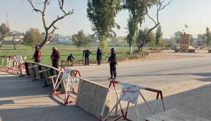 Pakistani soldiers stand guard on a road leading to the cantonment area in Bannu, Pakistan December 20, 2022. — Reuters