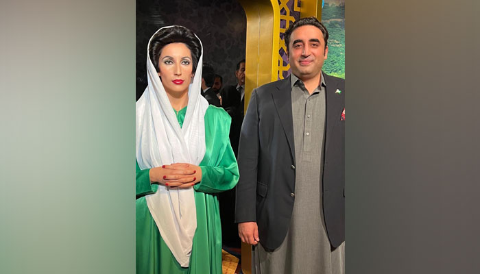 Foreign Minister Bilawal Bhutto Zardari with former prime minister Benazir Bhuttos wax statue after it was unveiled at Madame Tussauds in Dubai, UAE. — Foreign Office