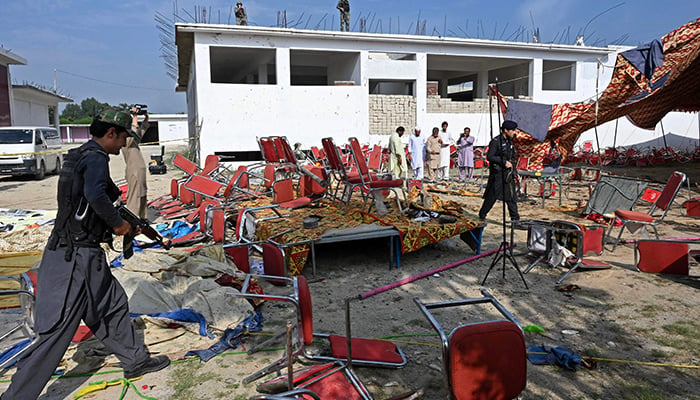 Security personnel examine the site of a bomb blast in Bajaur district of Khyber Pakhtunkhwa province on July 31, 2023. — AFP