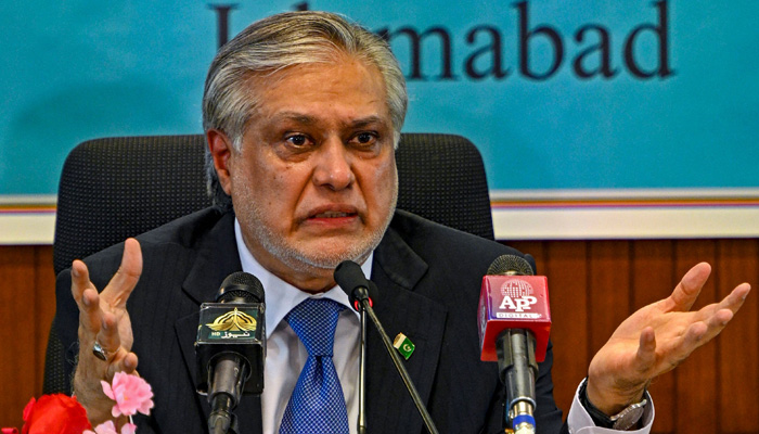 Finance minister Ishaq Dar speaks while presenting the economic report for fiscal year 2022-23, in Islamabad on June 8, 2023. — AFP