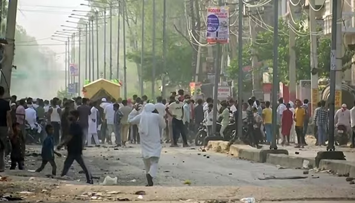 Chaos is visible in this photograph taken on August 1, 2023, as clashes erupt in Indias Haryana state. — ANI