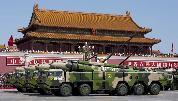 Chinese military vehicles carrying DF-21D anti-ship ballistic missiles, known as carrier killers, drive past Tiananmen Gate in Beijing during a military parade. — Reuters/File