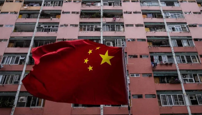 An image of a Chinese flag in front of a housing estate in Hong Kong on June 29 ahead of the 26th anniversary of the city’s handover from Britain to China on July 1 — AFP/Files