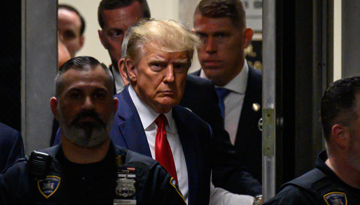 Former US President Donald Trump makes his way inside the Manhattan Criminal Courthouse in New York on April 4, 2023. — AFP
