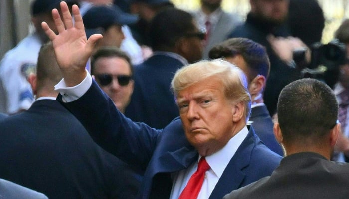 Former US president Donald Trump arrives ahead of his arraignment at the Manhattan Criminal Court in New York on April 4, 2023. — AFP