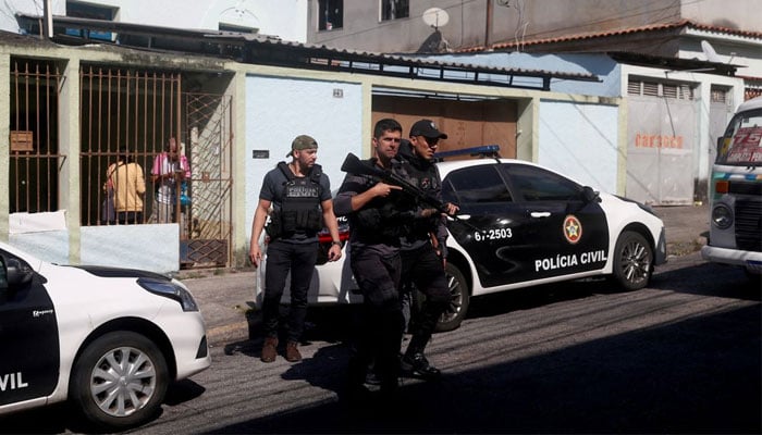 Police officers arrive at Getulio Vargas Hospital, after more than eleven people were killed during a police operation against drug dealers in the Vila Cruzeiro slum, in Rio de Janeiro, Brazil May 24, 2022. — Reuters