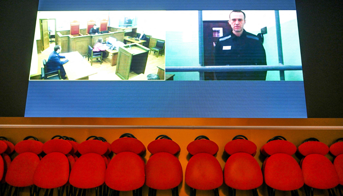 Russian opposition figure Alexei Navalny is seen on a screen via a video link from his penal colony during court hearings over the extremism criminal case against him at Russias Supreme Court in Moscow on June 22, 2023. — AFP