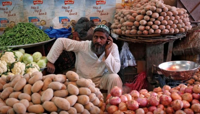 A man selling vegetables waits for customers at his makeshift stall at the Empress Market in Karachi, Pakistan April 2, 2018. — Reuters